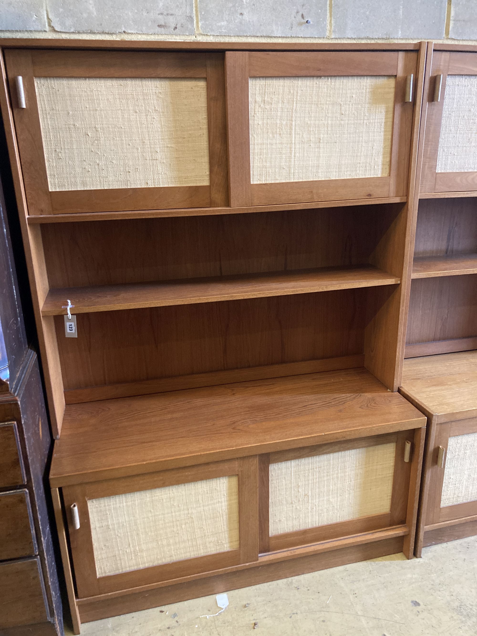 Three near-matching teak side cabinets,